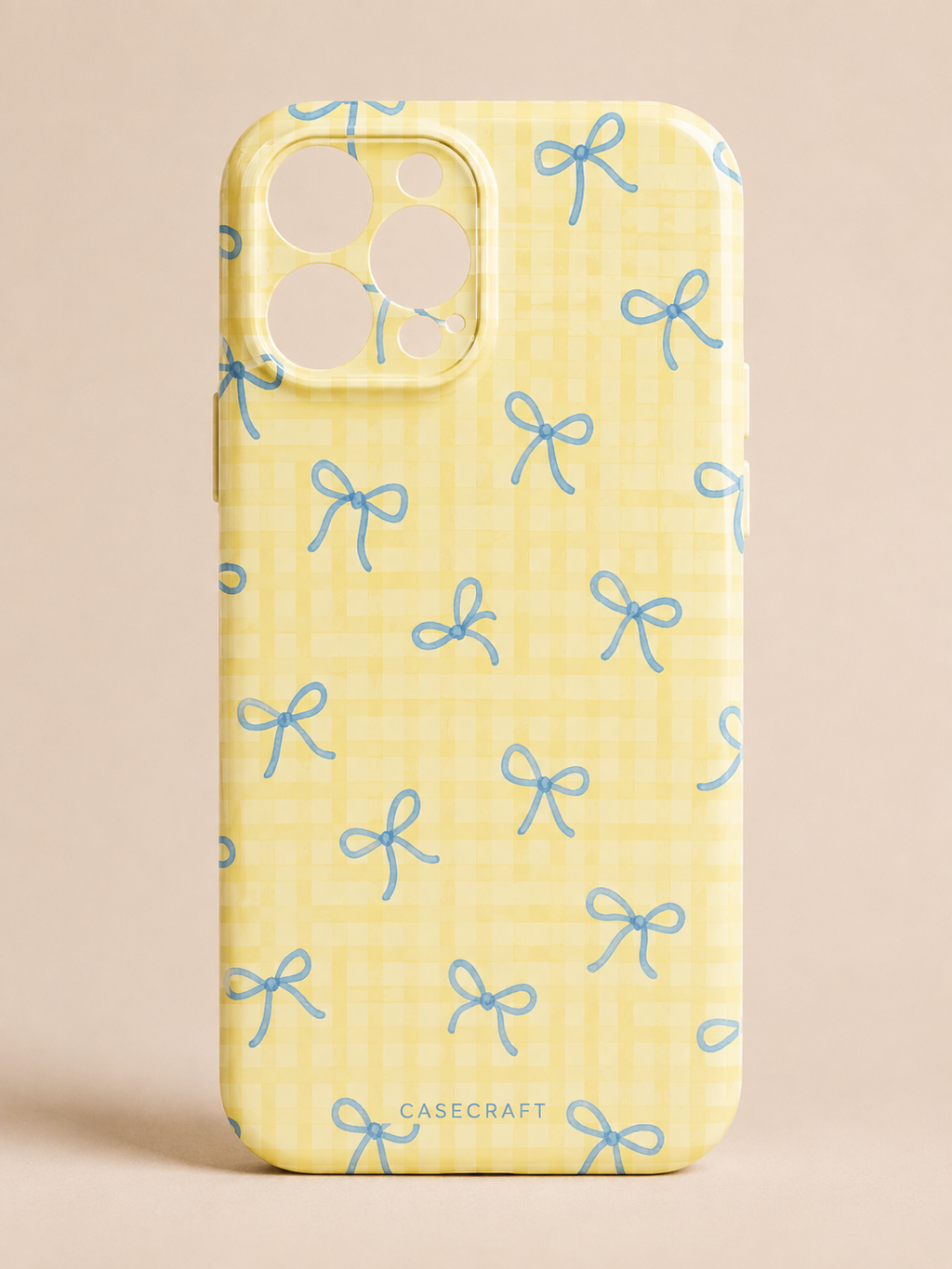Lemon Blue Bow Phone Case - yellow case with scattered blue hand-drawn bow pattern and CaseCraft branding
