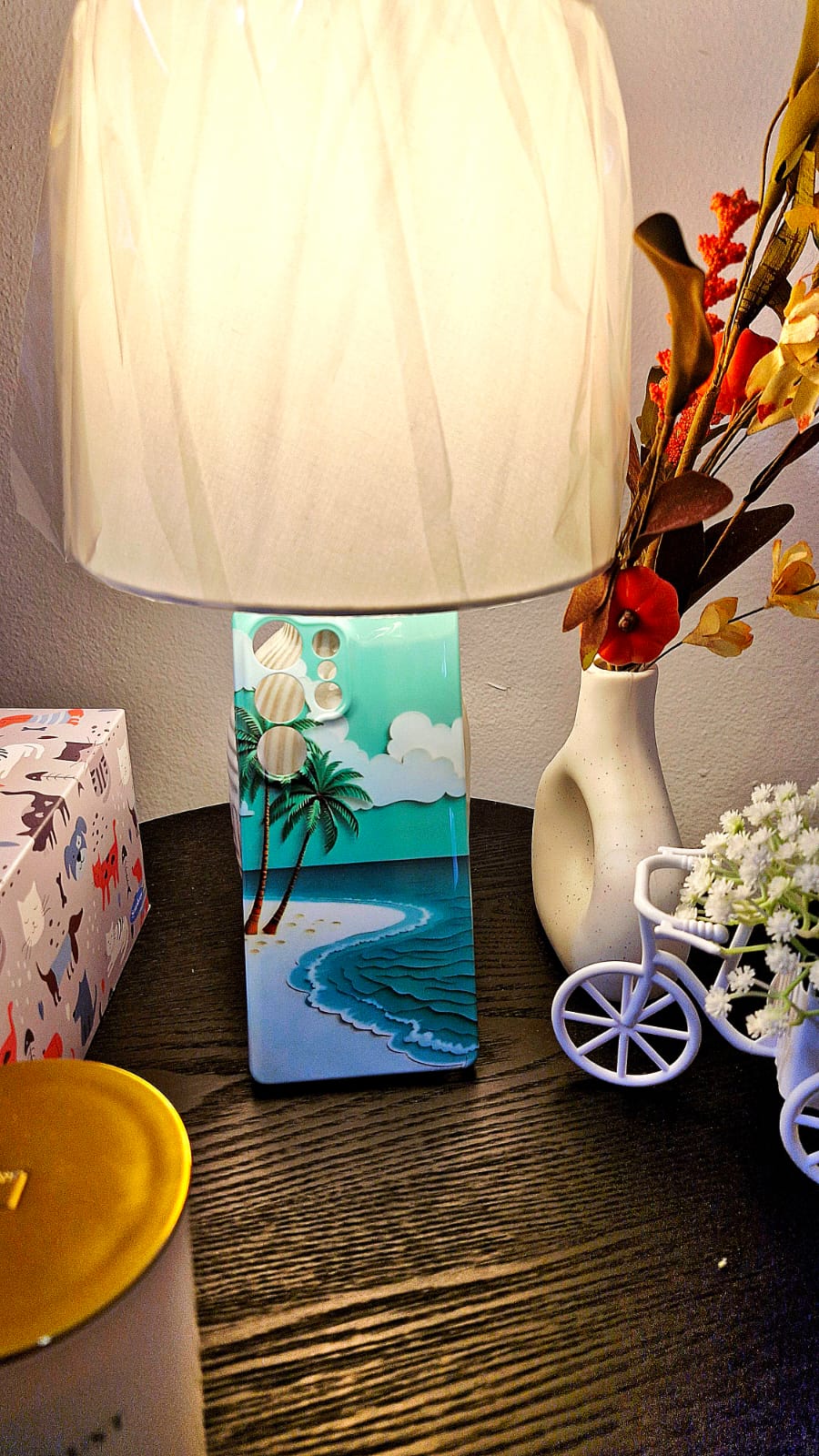 Tropical beach wave phone case lifestyle shot with lamp and decor