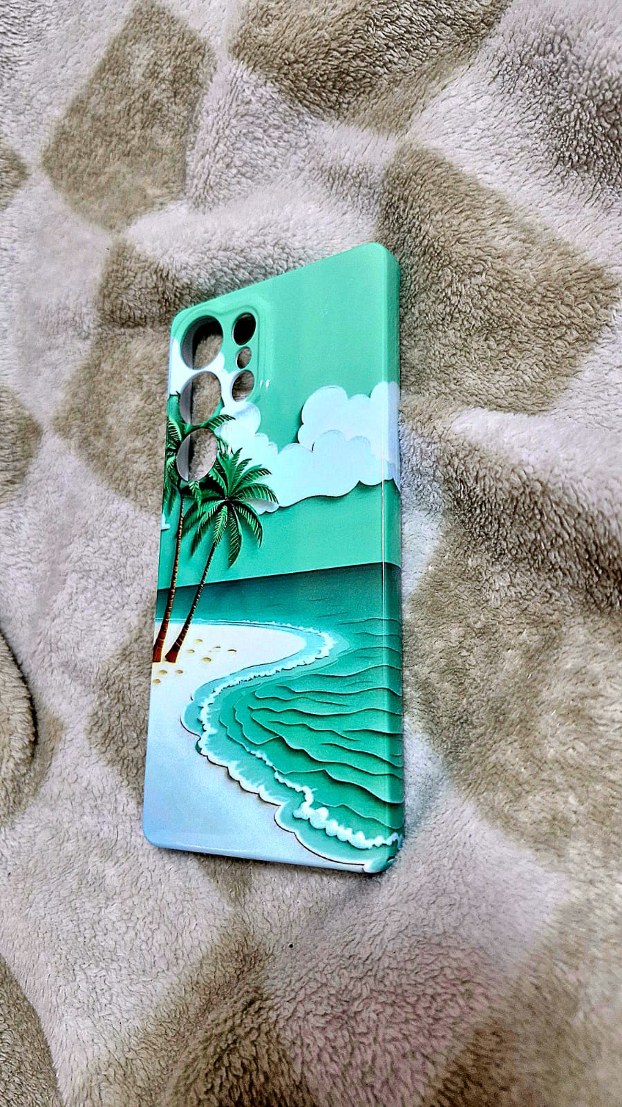 Tropical beach wave phone case side angle on fluffy surface