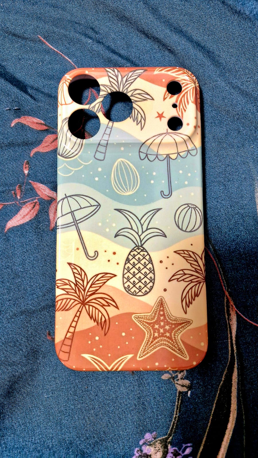 Beach doodle phone case angled view on denim fabric