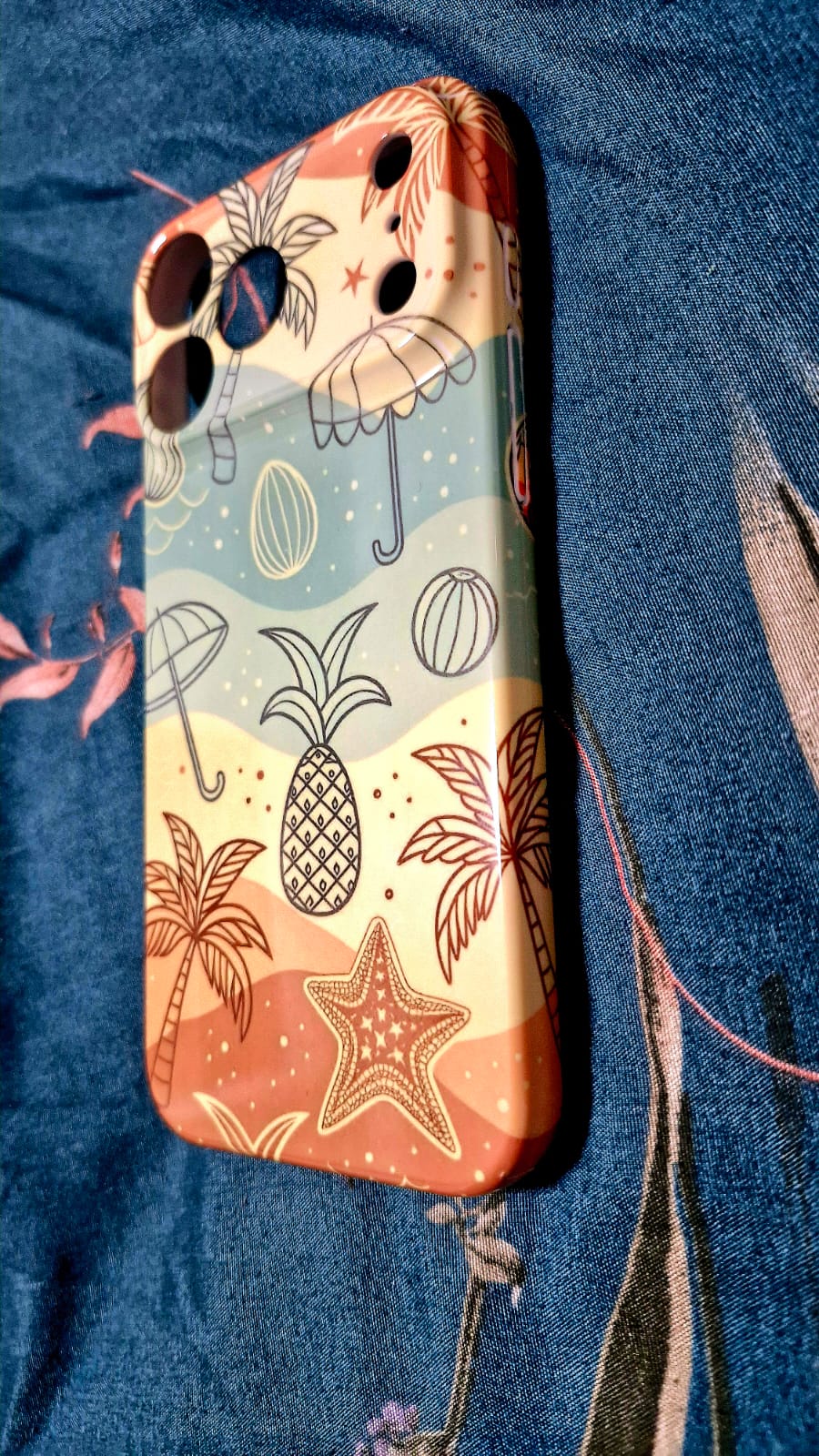 Beach doodle phone case back view on denim fabric
